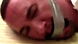 Victor sockgagged and tapegagged tight and captured with socks inside his mouth wrapped the tape around his head advance showing