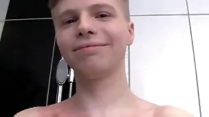 Cute butyraceous boy alone in a shower