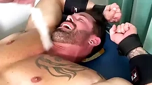 Robust hunk endures bondage and torment on half naked company